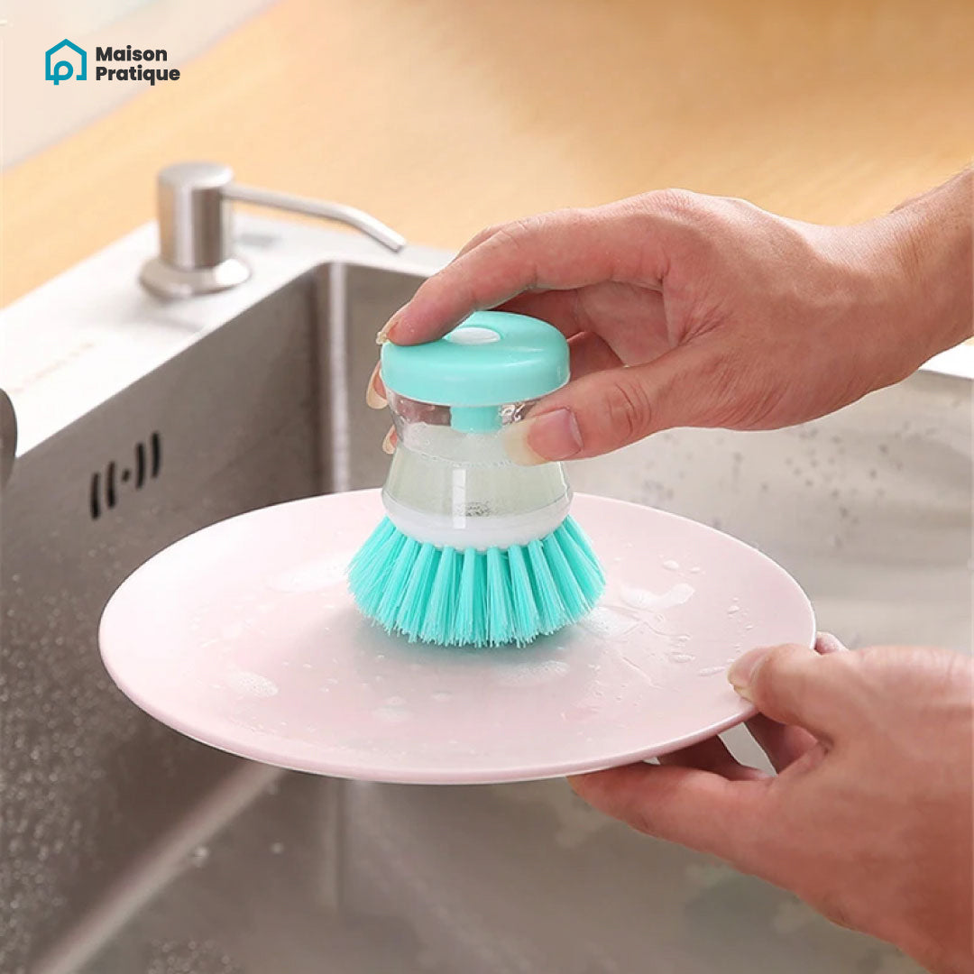 Brosse à vaisselle avec réservoir de produit