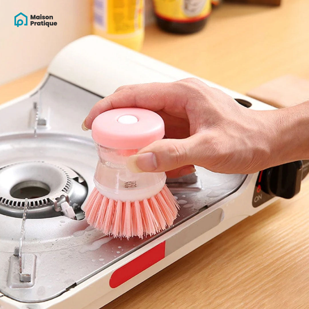 Brosse à vaisselle avec réservoir de produit